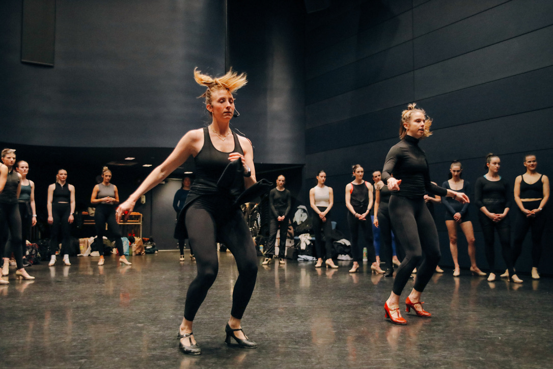 Sarah Hoge working through movement alongside a dancer
