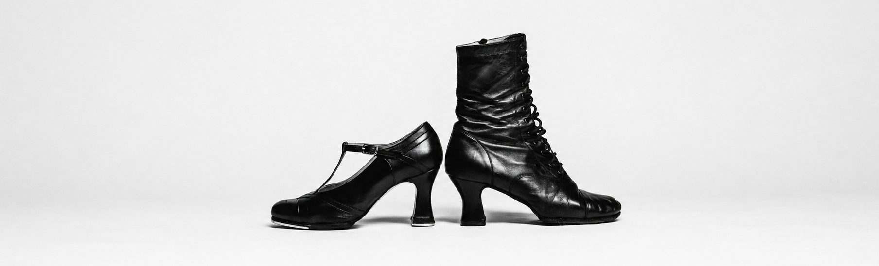 A vintage T-strap character heel beside a lace-up leather dance boot
